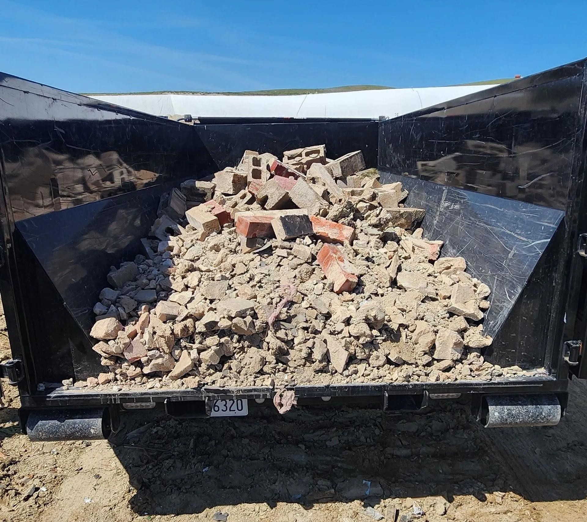 A trailer loaded with broken concrete and brick from a Bakersfield job site.
